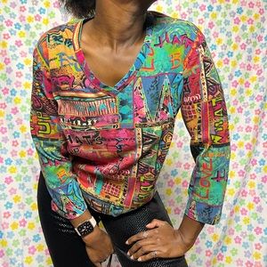 Chicos vneck tshirt. Unique. Size 1 but fits big. little faded but still bright